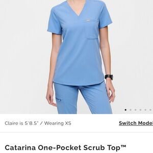 Brand: Figs 

Color: Ceil Blue 

Catarina One Pocket Scrub Top | M